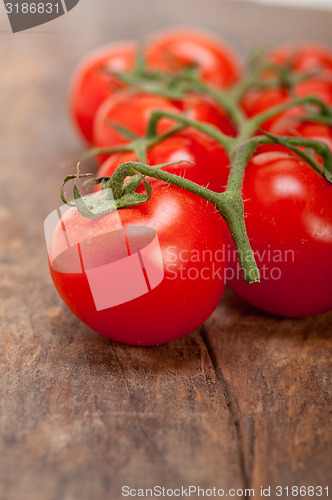 Image of fresh cherry tomatoes on a cluster