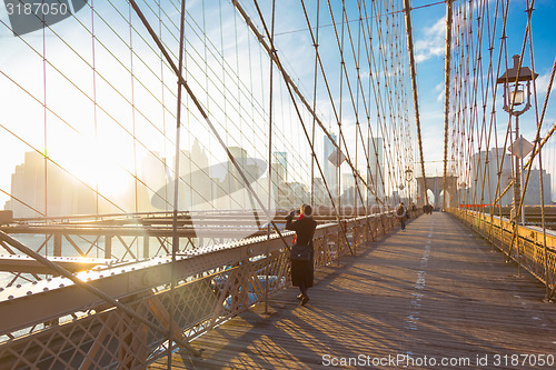 Image of Brooklyn bridge at sunset, New York City.