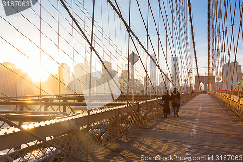 Image of Brooklyn bridge at sunset, New York City.