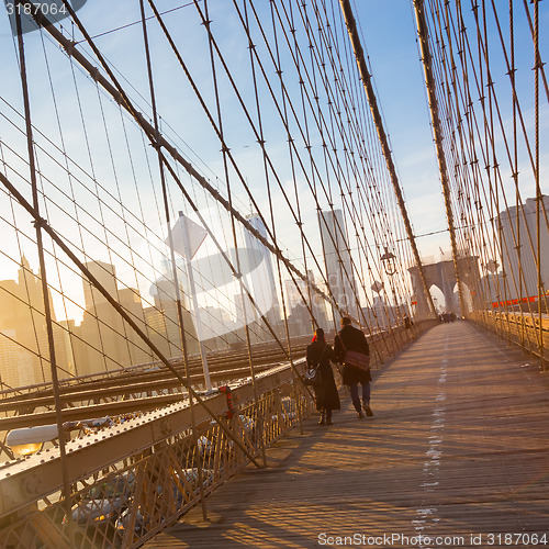 Image of Brooklyn bridge at sunset, New York City.