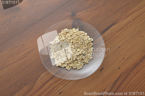 Image of Plate of glass with oat flakes