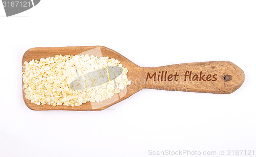 Image of Millet flakes on shovel