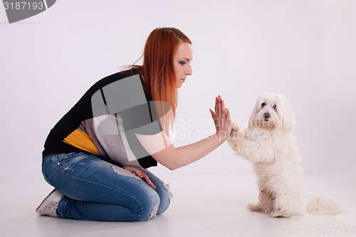 Image of Young woman with her dog