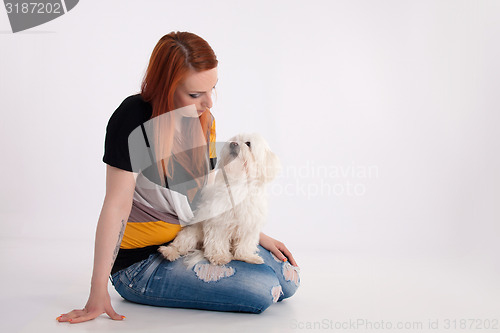 Image of Young woman with her dog