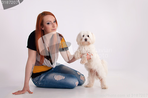 Image of Young woman with her dog