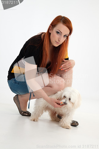 Image of Young woman with her dog