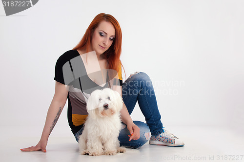 Image of Young woman with her dog