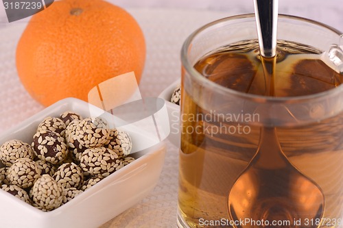 Image of hot cup of tea and some cookies