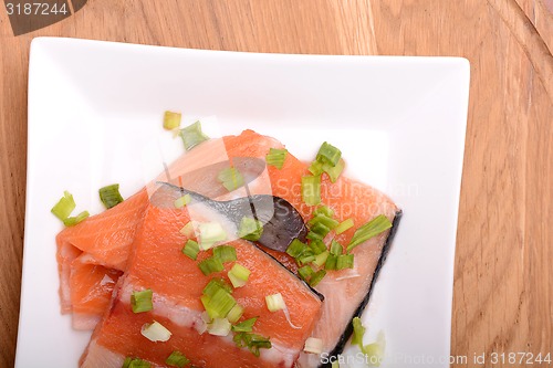 Image of Slice of red fish salmon on white plate