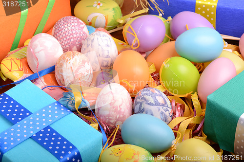 Image of Easter background with eggs, ribbons and spring decoration