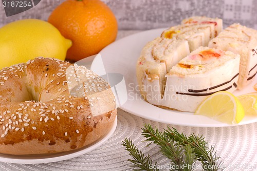 Image of sweet cake on white plate and fruits