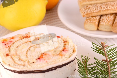 Image of sweet cake on white plate with lemon