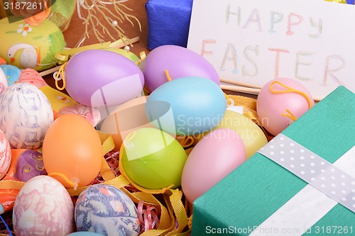 Image of Easter background with eggs, ribbons and spring decoration
