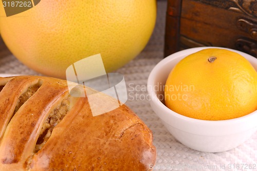 Image of sweet cake on white plate and fruits