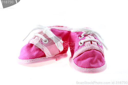 Image of Pink baby shoes isolated