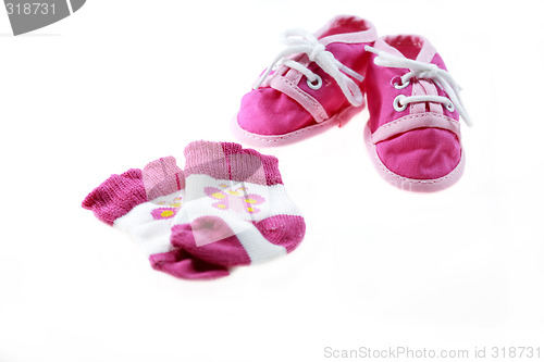 Image of Pink baby shoes and socks isolated