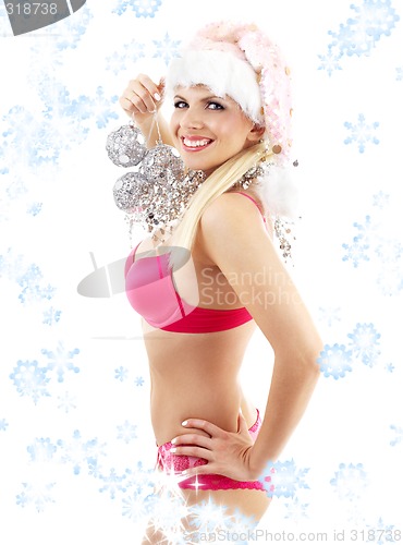 Image of santa helper with mirror balls and snowflakes