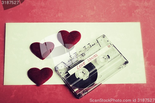 Image of Audio cassette tape on red backgound vintage tone color