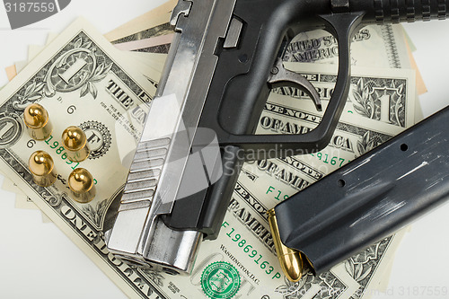 Image of gun with bullet on US dollar banknotes