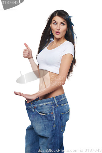 Image of Young woman delighted with her dieting results