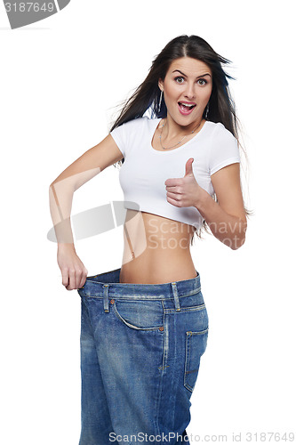 Image of Young woman delighted with her dieting results