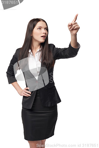 Image of Business woman pointing at blank copy space