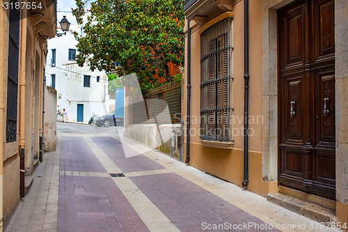 Image of Tossa de Mar, Spain, Carrer la Guardia street at summer day