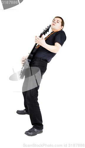 Image of young man with an electric guitar. Isolated