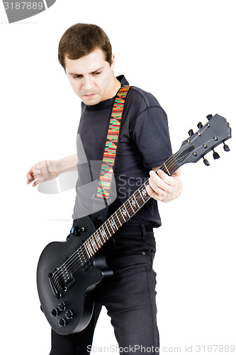 Image of young man with an electric guitar. Isolated