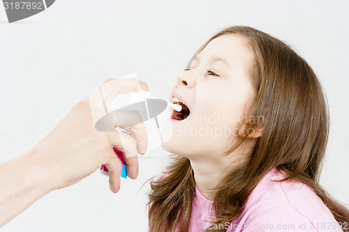 Image of Treatment of sore throat. Medicinal spray
