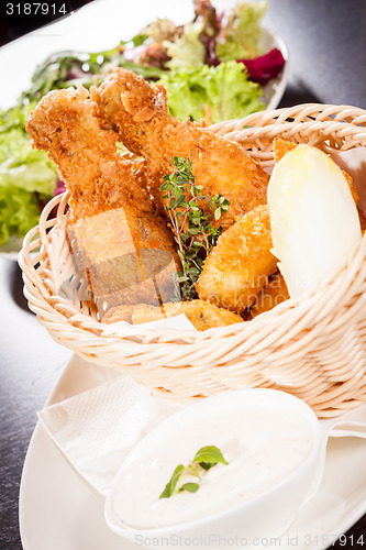 Image of Crisp crunchy golden chicken legs and wings