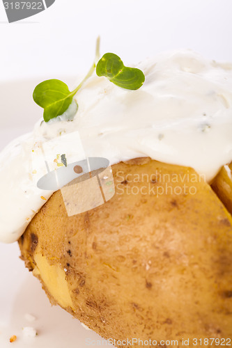 Image of Baked jacket potato with sour cream sauce