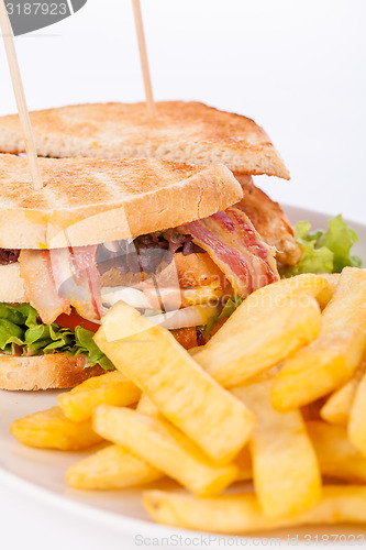 Image of Club sandwich with potato French fries