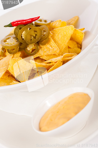 Image of Nachos with cheese sauce and chilli pepperoni