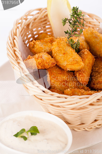 Image of Crumbed chicken nuggets in a basket