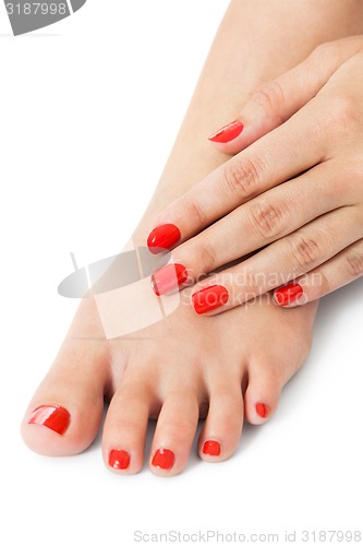 Image of Woman with beautiful red finger and toenails