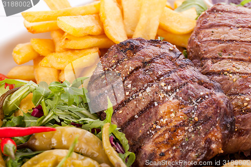 Image of Platter of mixed meats, salad and French fries