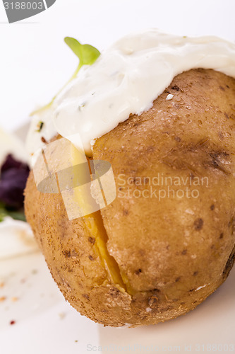 Image of Baked jacket potato with sour cream sauce