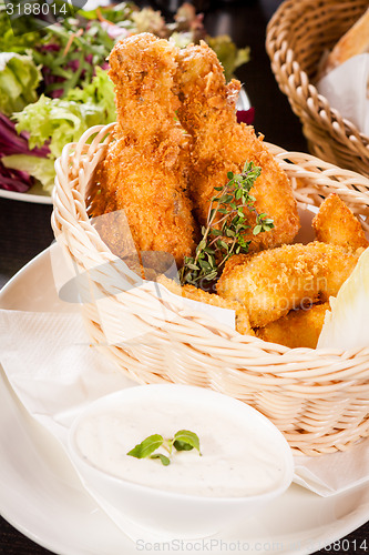 Image of Crisp crunchy golden chicken legs and wings