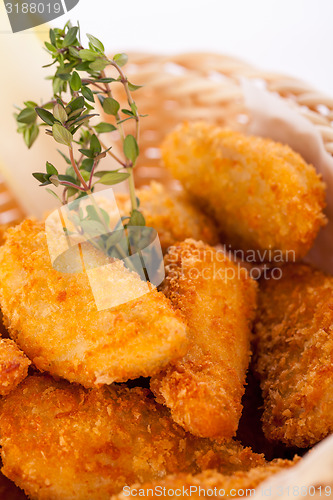 Image of Crumbed chicken nuggets in a basket