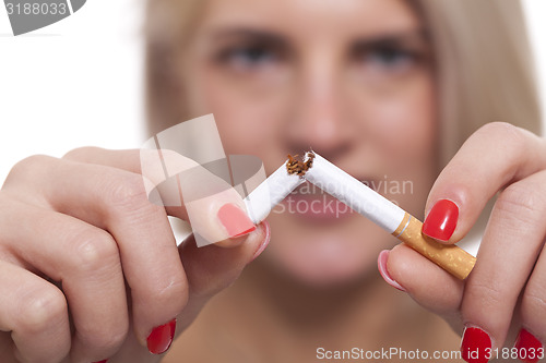 Image of Close up Young Woman Breaking a Cigarette Stick