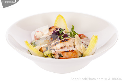 Image of tasty fresh caesar salad with grilled chicken and parmesan