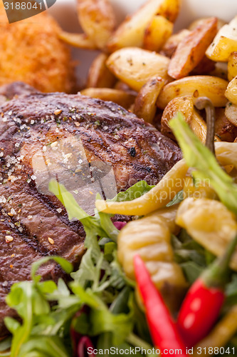 Image of Platter of mixed meats, salad and French fries