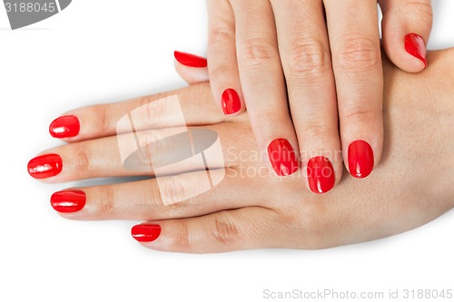 Image of Woman with beautiful manicured red fingernails