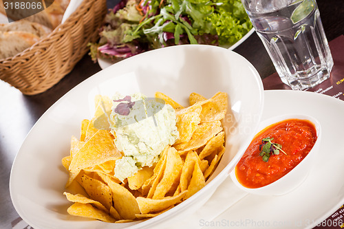 Image of Crisp corn nachos with guacamole sauce