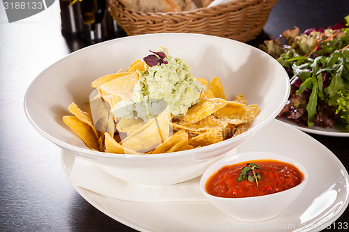 Image of Crisp corn nachos with guacamole sauce