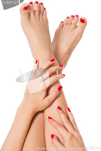 Image of Woman with beautiful red finger and toenails