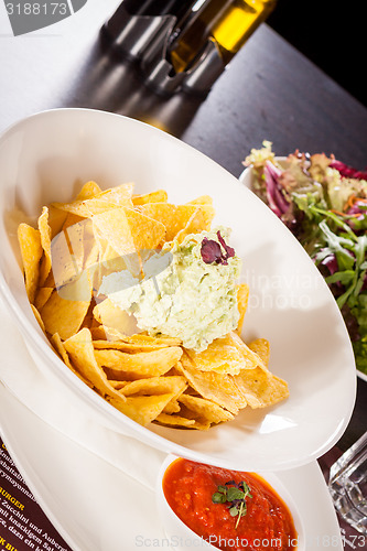 Image of Crisp corn nachos with guacamole sauce