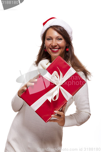 Image of Pretty woman in a Santa hat with a large gift