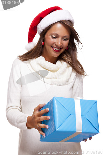 Image of Beautiful vivacious woman with a Christmas gift